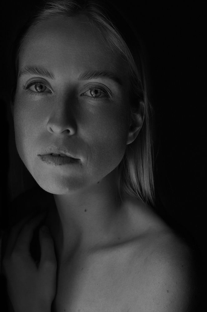 A monochrome portrait of a young woman 