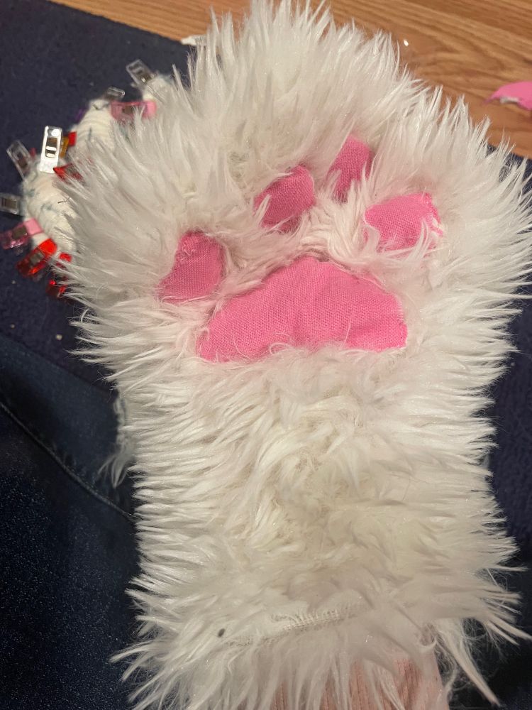 Fur-suit paw from the front, posed to hide imperfections.