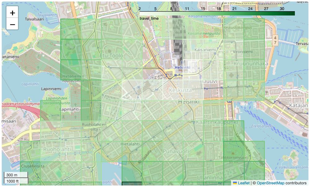 A map of central Helsinki. A transparent overlay shows a grid of cells that are coloured according to the time needed to travel to their centre point from the railway station