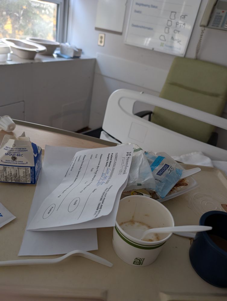 My first solid food after almost 48 hours. Photo of hospital table with menu, empty oatmeal bowl and spoon. Empty coffee cup, empty wrappers. You get the idea! I was hungry! Hospital food never tasted so good! 