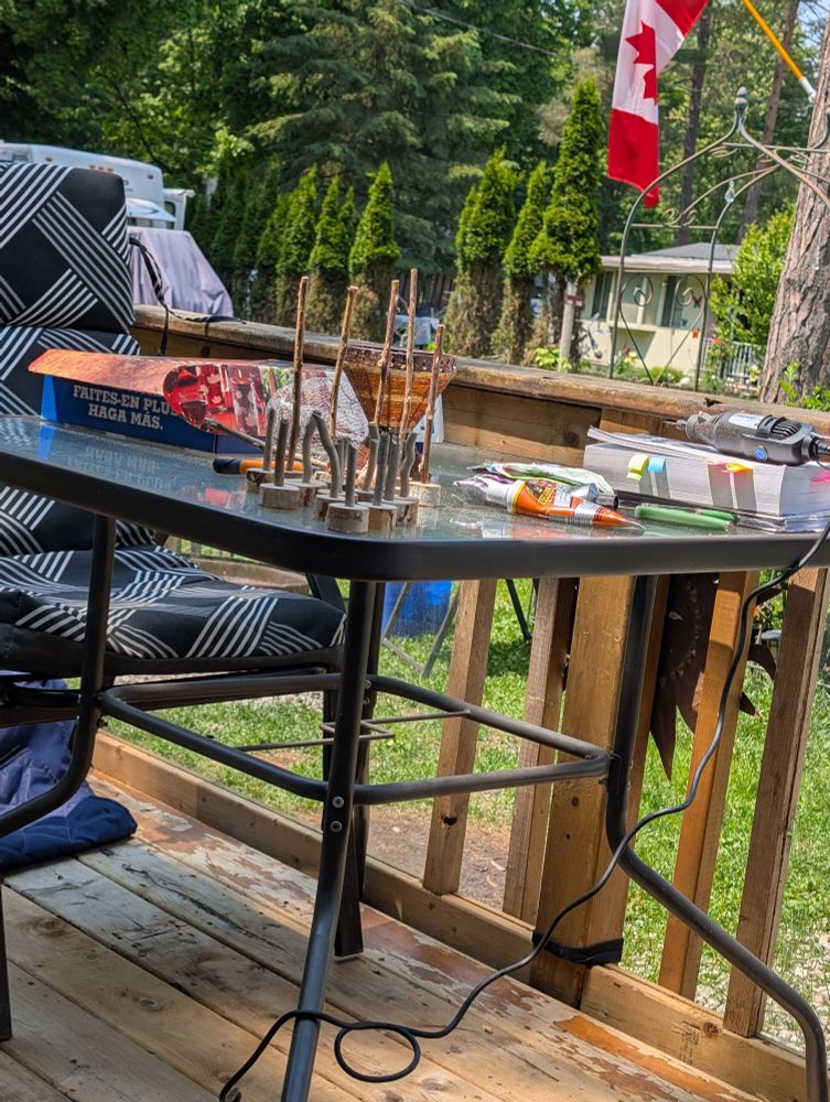 Crafts and books on the table of the deck.