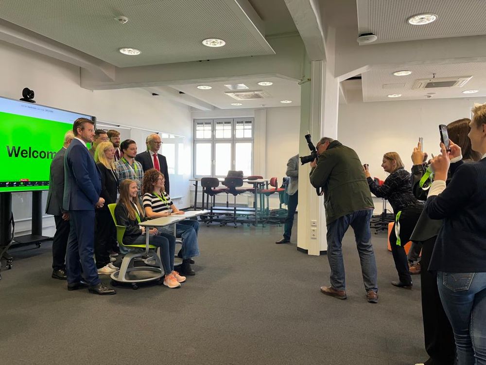 Photo shows first students at UTN including president, kanzler, mayor of Nuremberg, myself. This groups is filmed by media, newspaper.