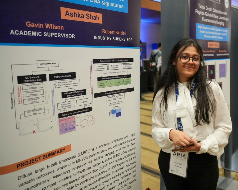 Master of Science in Applied Computing (MScAC) student Ashka Shah stands next to her research poster at the Department of Computer Science’s Applied Research in Action (ARIA) Showcase on November 13, 2025.