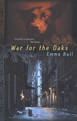 A cover for War for the Oaks by Emma Bull. It depicts buildings lining an empty city street at night with a red puff of smoke in the sky.