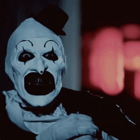 Art the clown carrying his garbage bag of toys aka weapons staring menacingly 