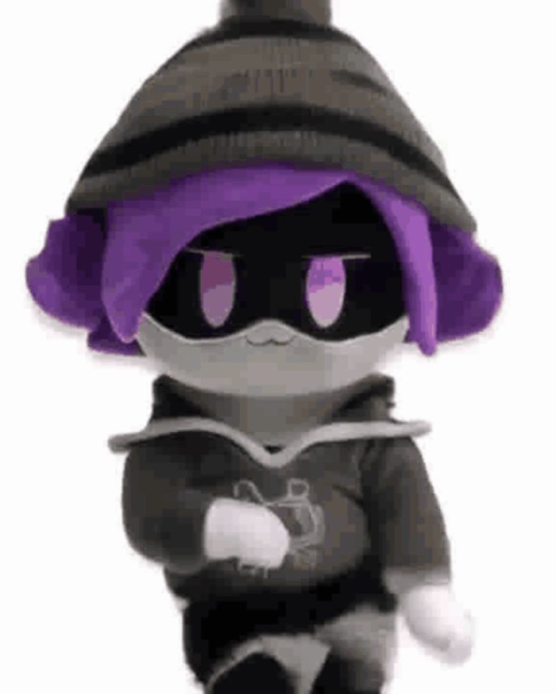 a stuffed animal with purple hair is wearing a mask and a hoodie .