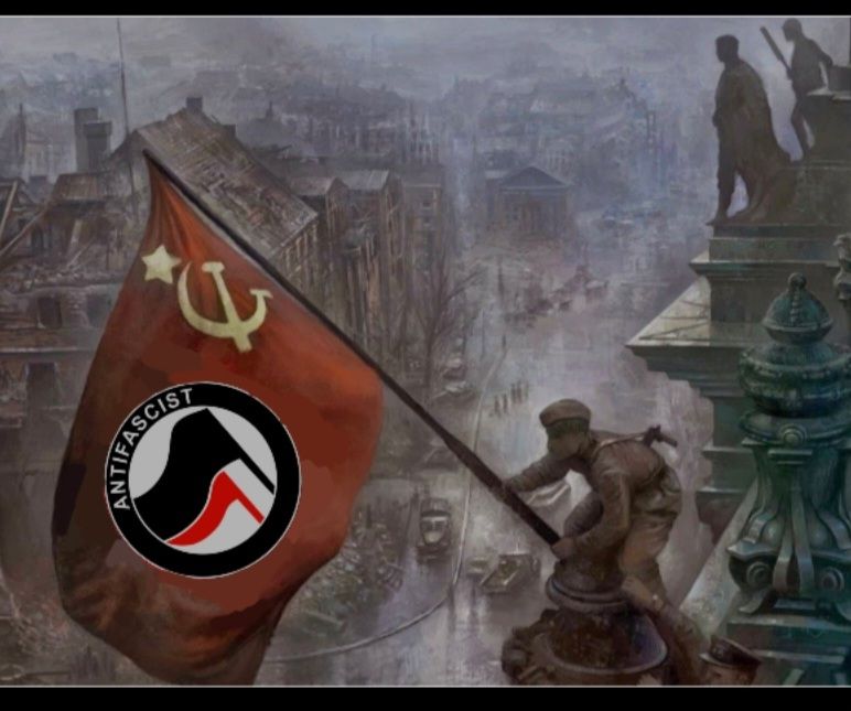 Communist waving a flag in Berlin, and the anti-fascist symbol has been added