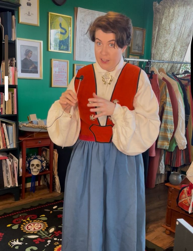 She’s holding a microphone on a stick