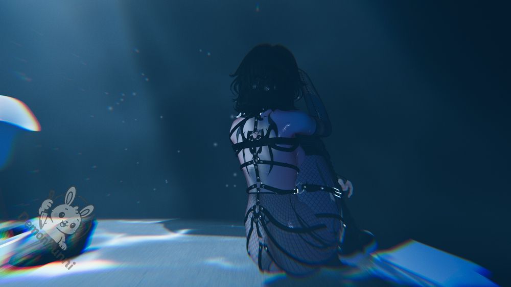 Photograph of a person in a harness and fishnets, sitting in water. The person is facing away from the viewer. The water is dark and there are bubbles in the water. The logo for "demonbunni" is in the lower left corner.