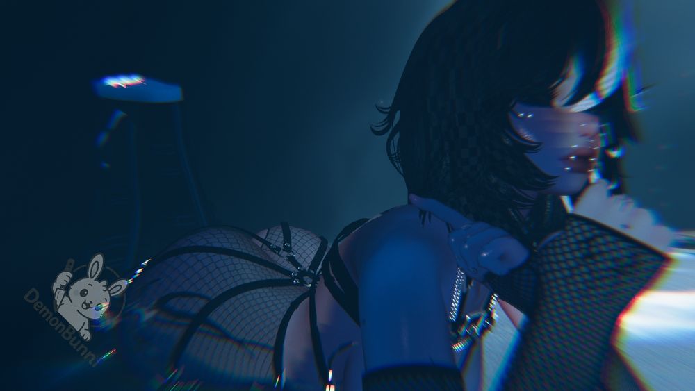Photograph of a woman in fishnets and a harness, with a "DemonBunn/" logo in the lower left.