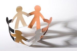 Paper chain of people holiding hands 