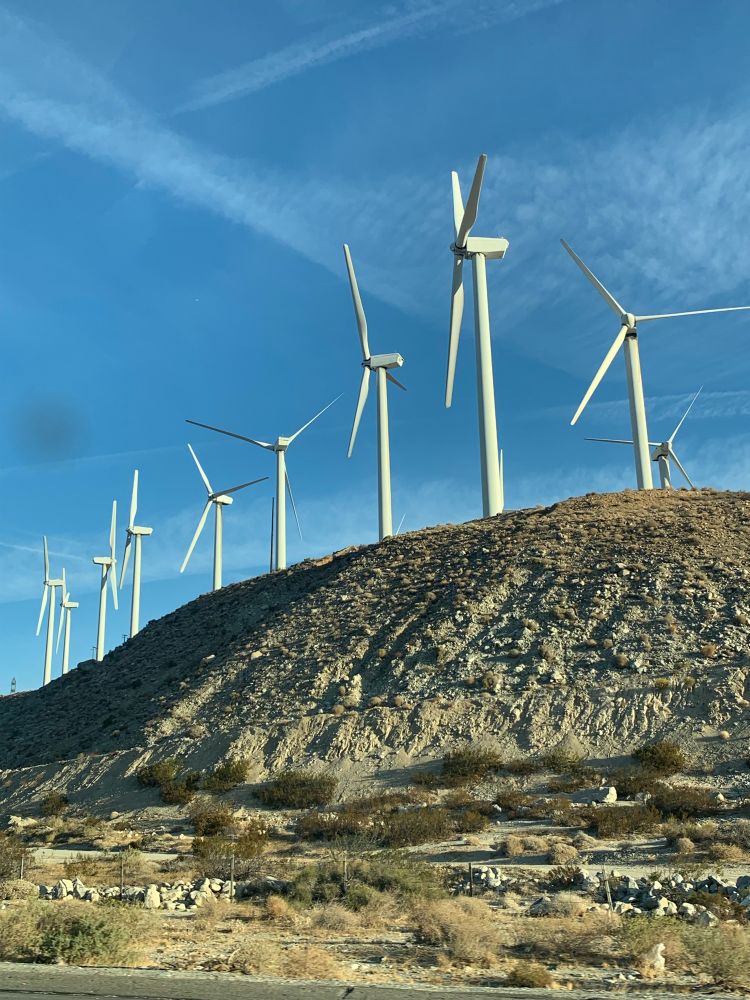 Windmills aligned in a desert hill. 