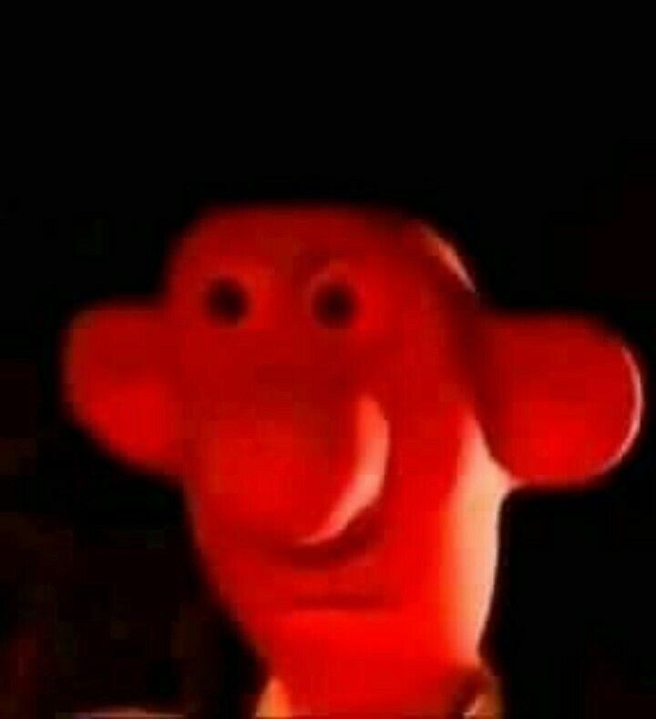 wallace looking like he’s got barely contained rage, red face, flat mouth, wide eyes