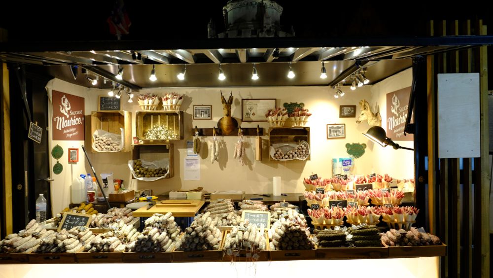 A Christmas market stand selling sausages