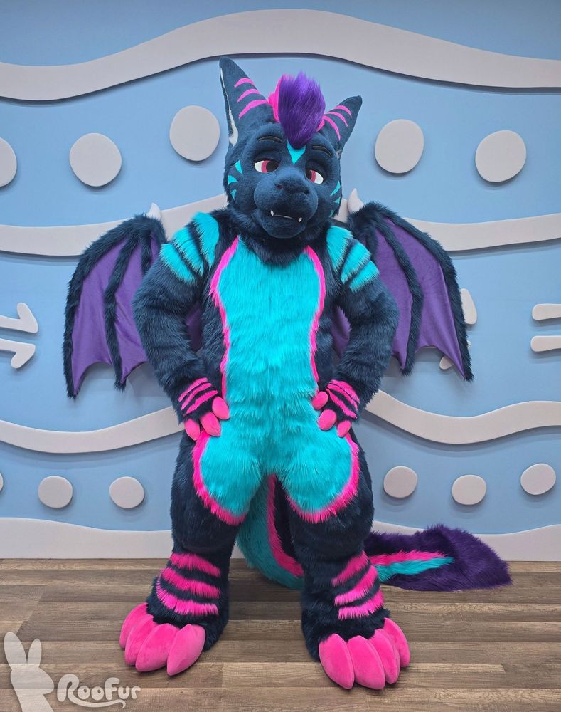 Fursuit photo of Rezz, the synthwave fluffdragon standing with hands at their hips