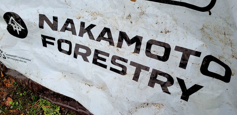 Plastic packaging showing the name and logo of a company called Nakamoto Forestry