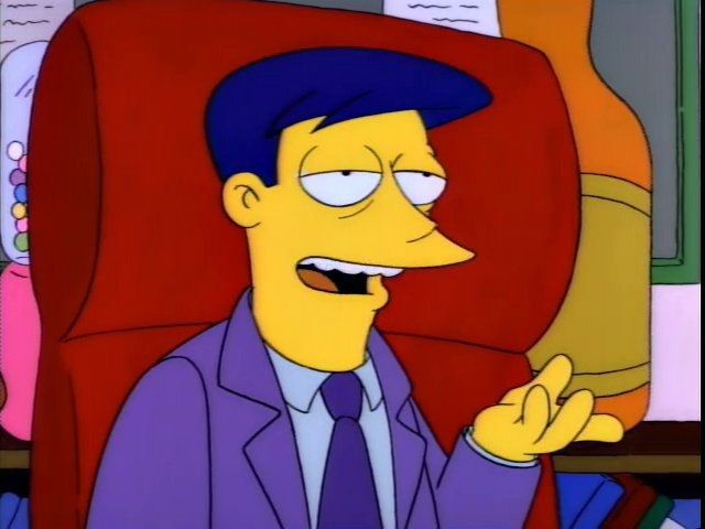 A CEO-type guy talking with a bragging expression on his face. 