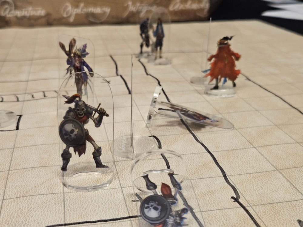 Skeleton and pirate standees on a battle mat 