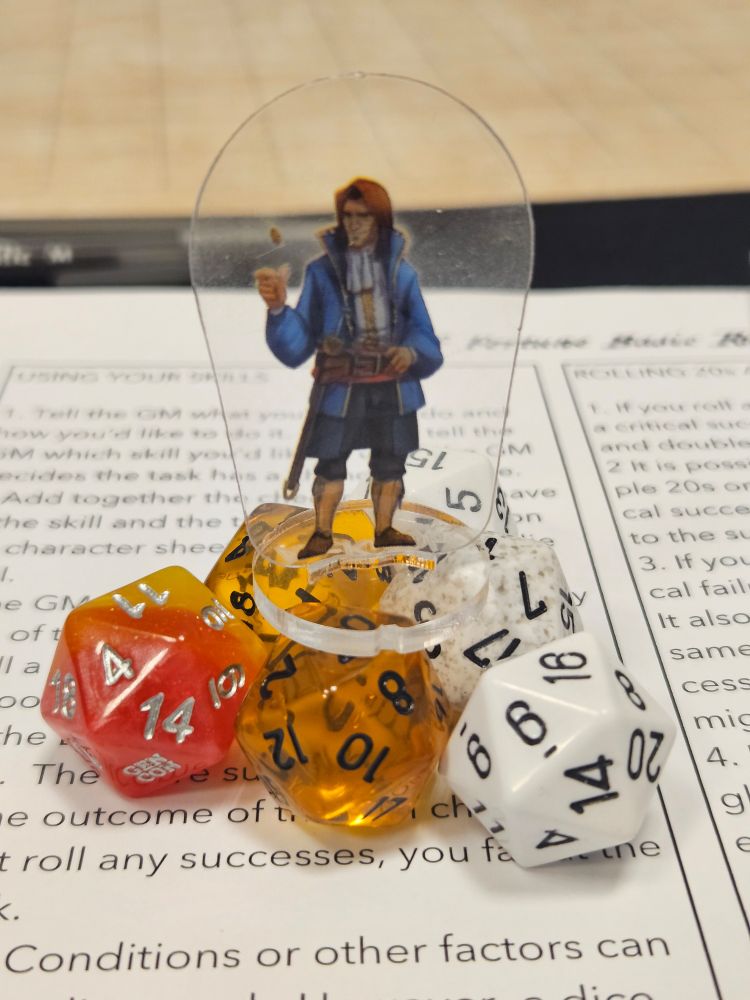 A pirate standee perched atop a pile of d20s. It's a d20 pool system 