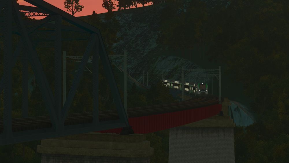 An early morning screenshot of a Regio 2N train approaching the bridge.