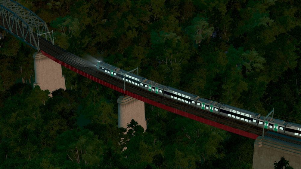 Same train from previous screenshot crossing the plate girder portion of the bridge.