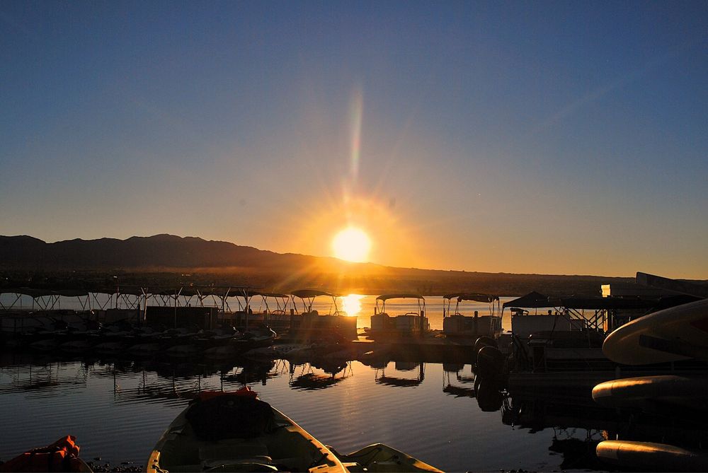 The sunrise captured from a deserted watercraft rental facility 