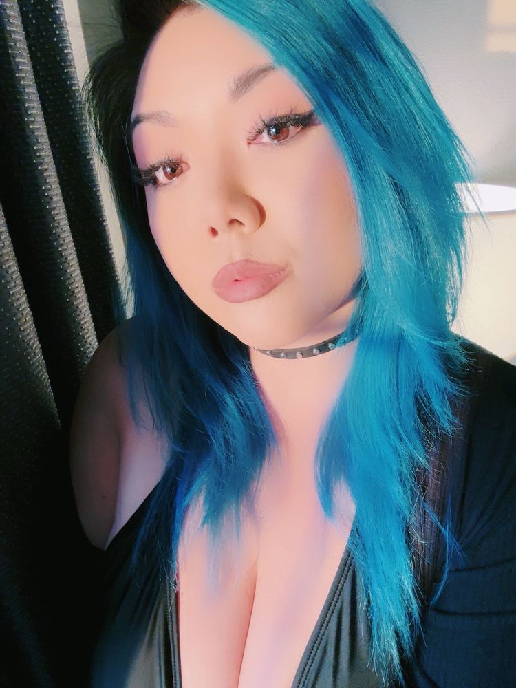 Photo of kimb wearing a black top, sweater, and choker with blue hair 


🧡🖤