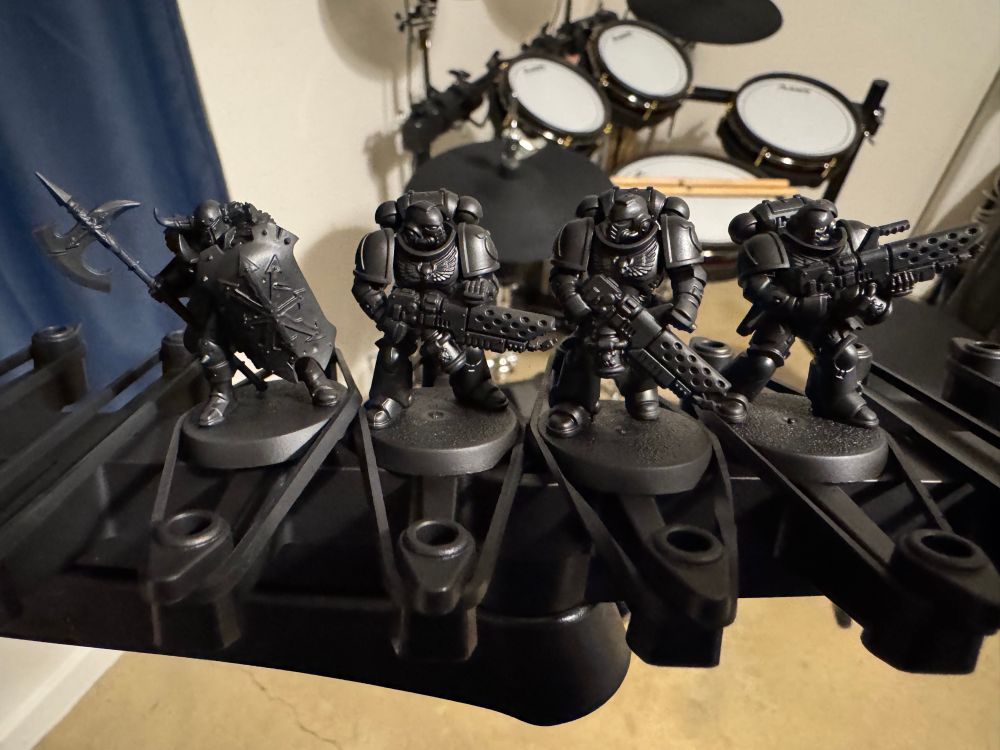 4 assorted Warhammer miniatures, painted with black primer