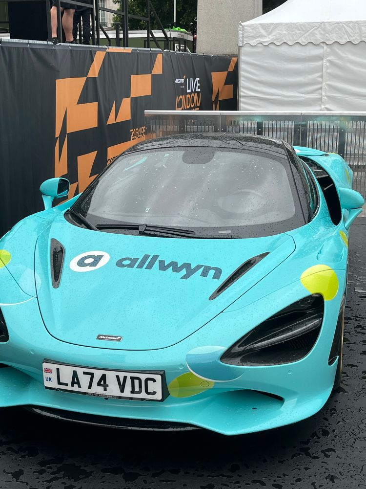 A McLaren sports car in “allwyn” racing livery.
