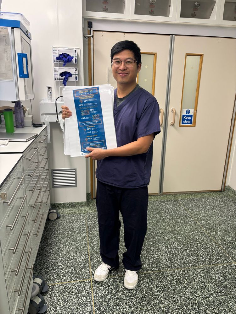 Man standing with poster 