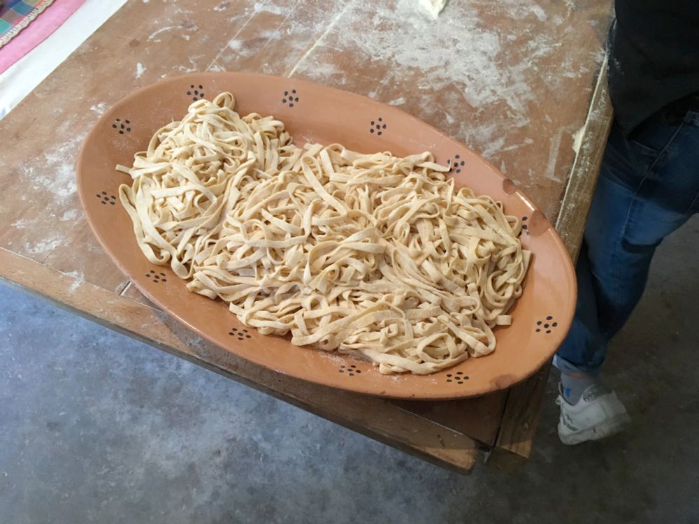 A platter of fresh, uncooked tagliatelle. 