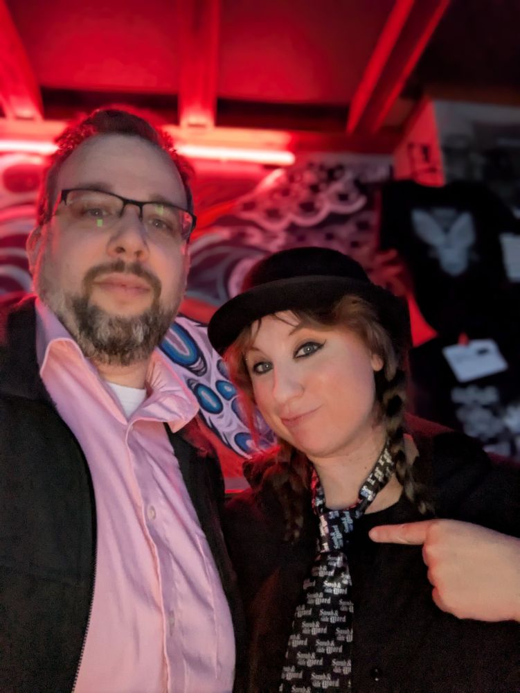 Beth from Sarah and the Safe Word wearing a custom tie with the band's logo.
