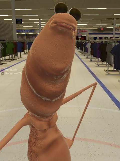 Photo is a still from a Marcus the Worm video, showing  an upright worm with eyes and arms. 