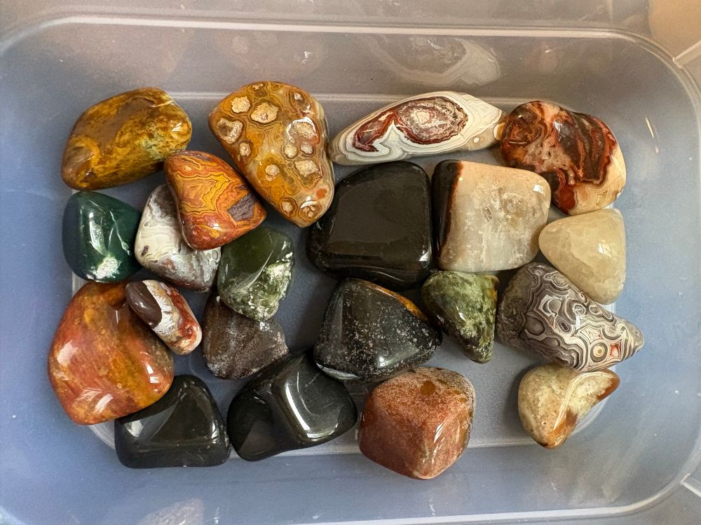 A container or polished stones, agate and jasper