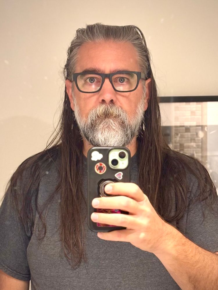Selfie: A white guy with a beard and long hair.