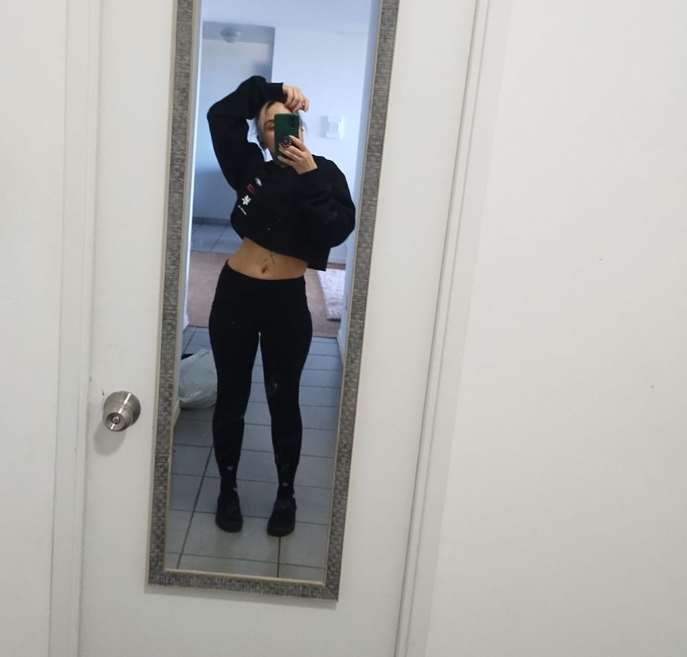 Selfie of Bambii a sex worker and trans masc individual. Zi has one of zir hands on top of zir head and zir other hand is holding zir phone in front of zir face. 

Zi is wearing a baggy black crop top hoodie and Capri tights with black compression socks with white hearts on them underneath and some black vans. 

Zi has curves for days. 

White walls, greyish/blue tile is visible in the background. 

#findomme #musclemommy #payslut #paypig #financialdomination #activist 