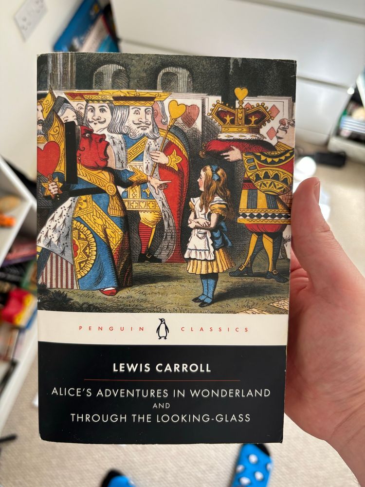 A picture of the book - Alice’s Adventures in Wonderland & Through the Looking Glass by Lewis Carroll