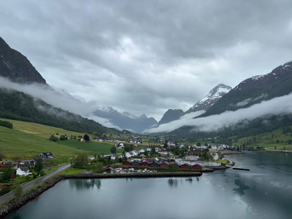 Picture of a mountainous backdrop surrounding the town of Olden in Norway