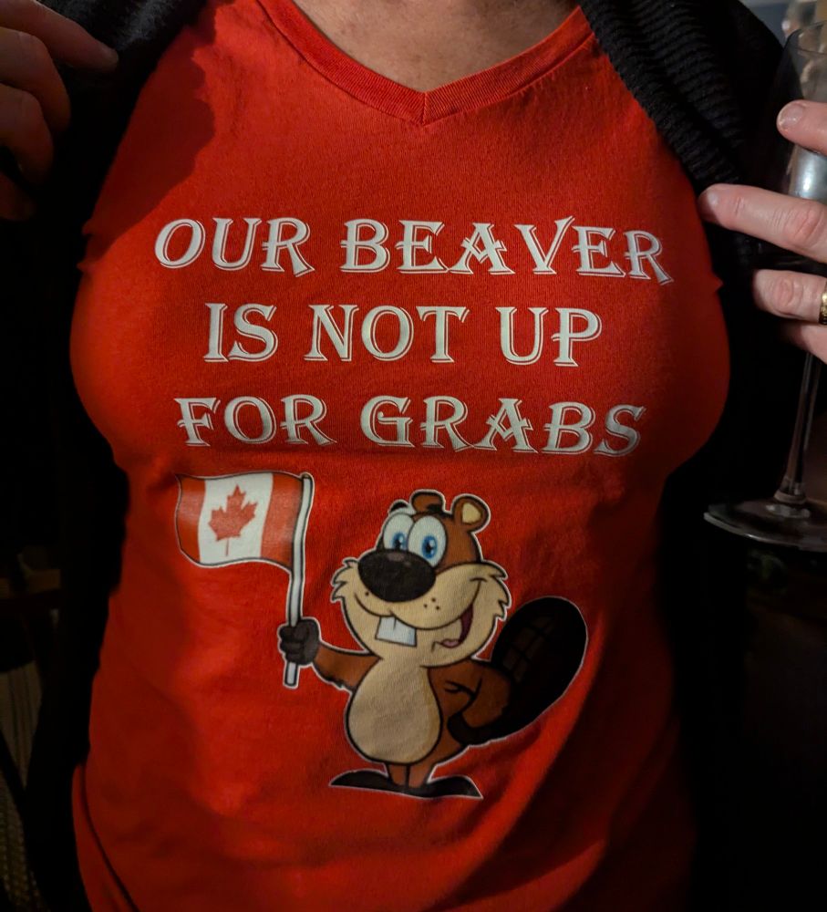 A woman wearing a T-shirt saying "our beaver is not up for grabs"