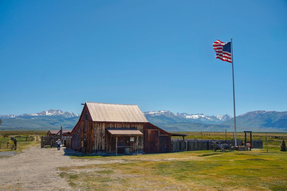 Mister, Catch Me If You Can

A friend came visiting from Mexico. We drove over the Sonora Pass, a mountain pass in the Sierra Nevada in California. On the other side of the mountain we stopped for coffee in Bridgeport. I noticed a barn next door with an oversized flag. A man waved at me when I took a photo. I hopped over the fence to talk to the person, who happens to be the owner of this place -- a wedding venue. He said it's fully booked on weekends in summer.

-- ƒ/8.0, 22 mm, 1/400, 1/1600, 1/4000 sec, ISO 320, Sony A6400, SEL-P1650, HDR, CC BY-NC-SA 4.0, © 2025 Peter Thoeny, Quality HDR Photography