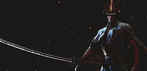 Sword Saint Isshin from Sekiro throws blood from his blade.