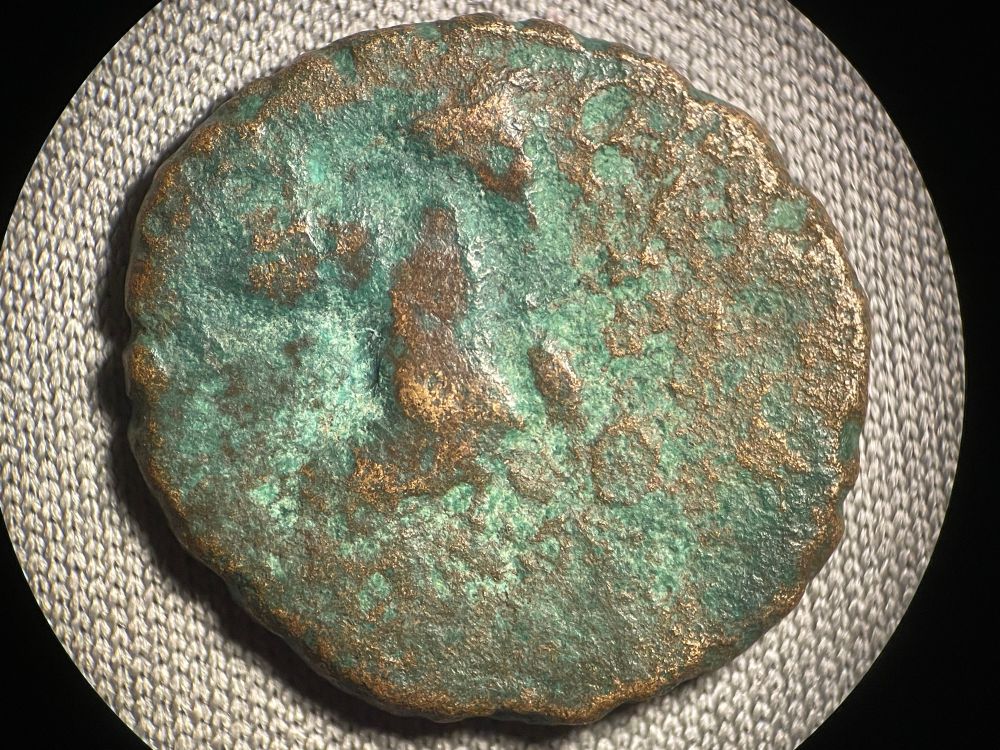 Obverse Marsyas standing right, holding wineskin