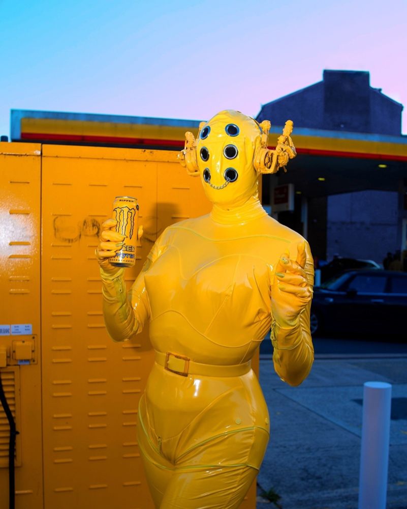 Me in a yellow robot drag look outside a petrol station