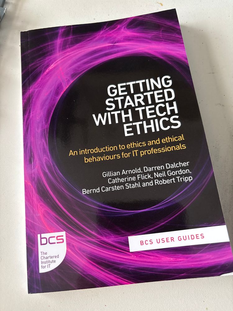 A book with a black cover featuring a big purple swirl. The title is “getting started with tech ethics”