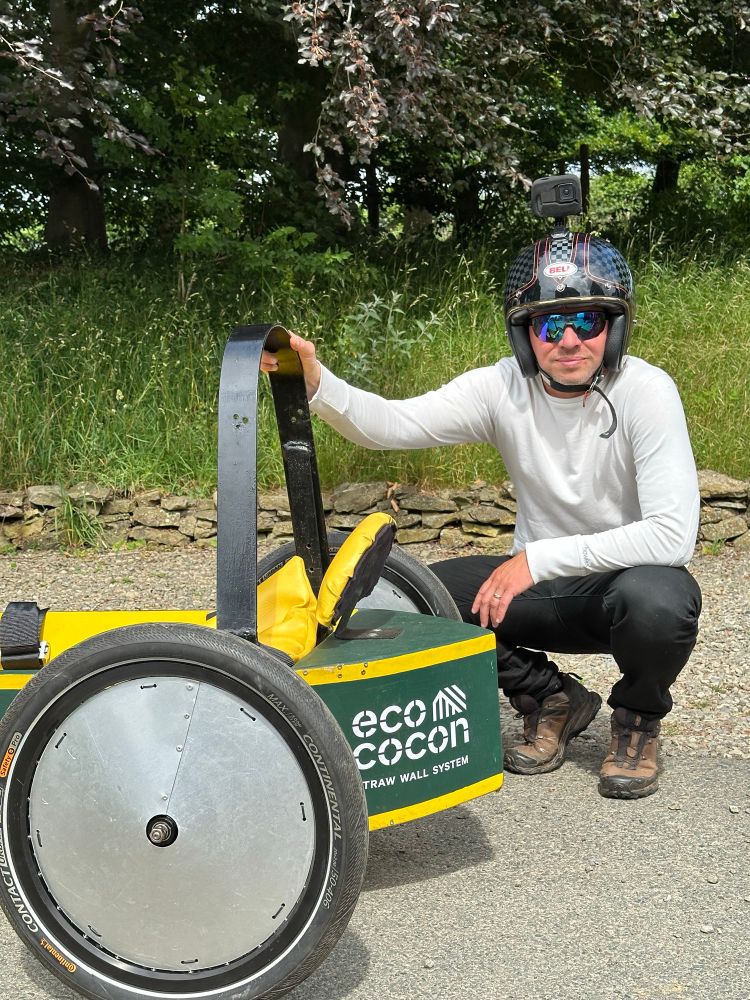 George Mikurcik of Ecococon posing by his soapbox for team Passiv Agressiv