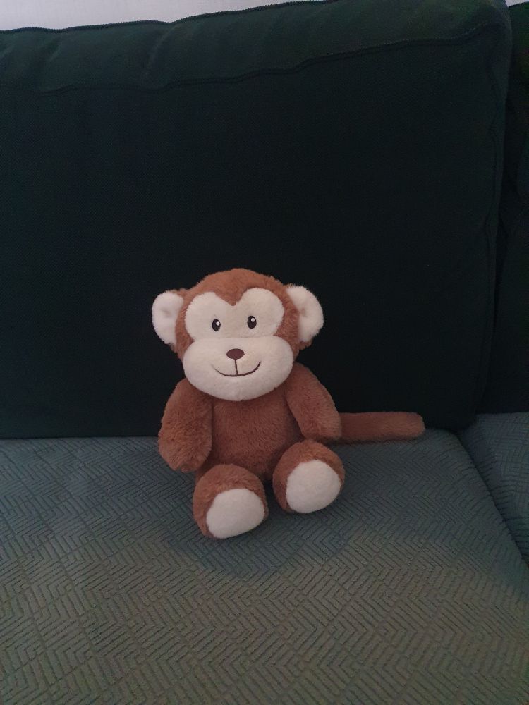 Entzückende kleiner Plüsch-Affe