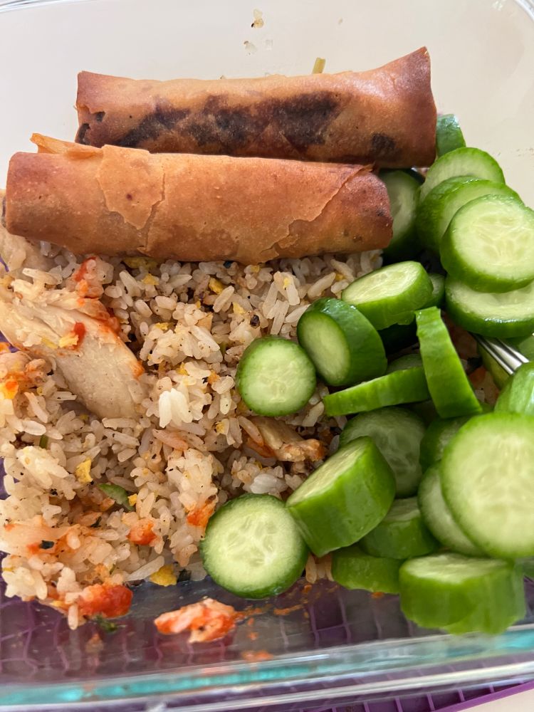 Fried rice, egg rolls, cucumbers