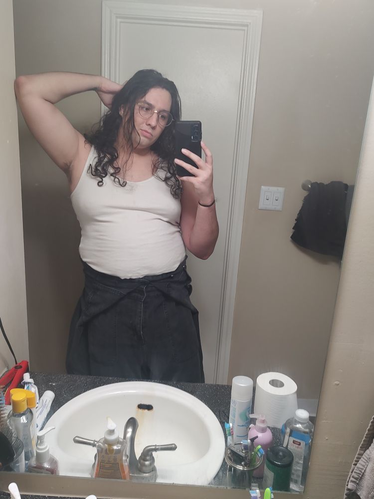 same outfit, but i have the top half of the jumpsuit off & hanging at my waist