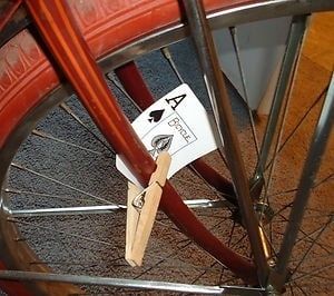 A playing card attached to the front fork of a bicycle by a clothes peg, so that when it hits against the moving spokes it makes a thhhrrrrrrrp sound, like a motorbike engine but not really like a motorbike engine obviously.