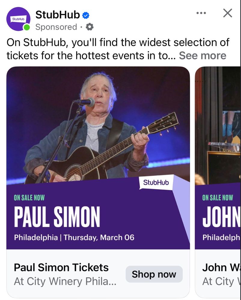 A StubHub sponsored advertisement showing a promotional image for Paul Simon in concert. The image features a performer on stage with an acoustic guitar singing into a microphone, wearing a gray t-shirt and blue jacket. Below, text indicates the concert is 'ON SALE NOW' for a show in Philadelphia on Thursday, March 06 at City Winery. The StubHub logo and a 'Shop now' button are visible on the advertisement.